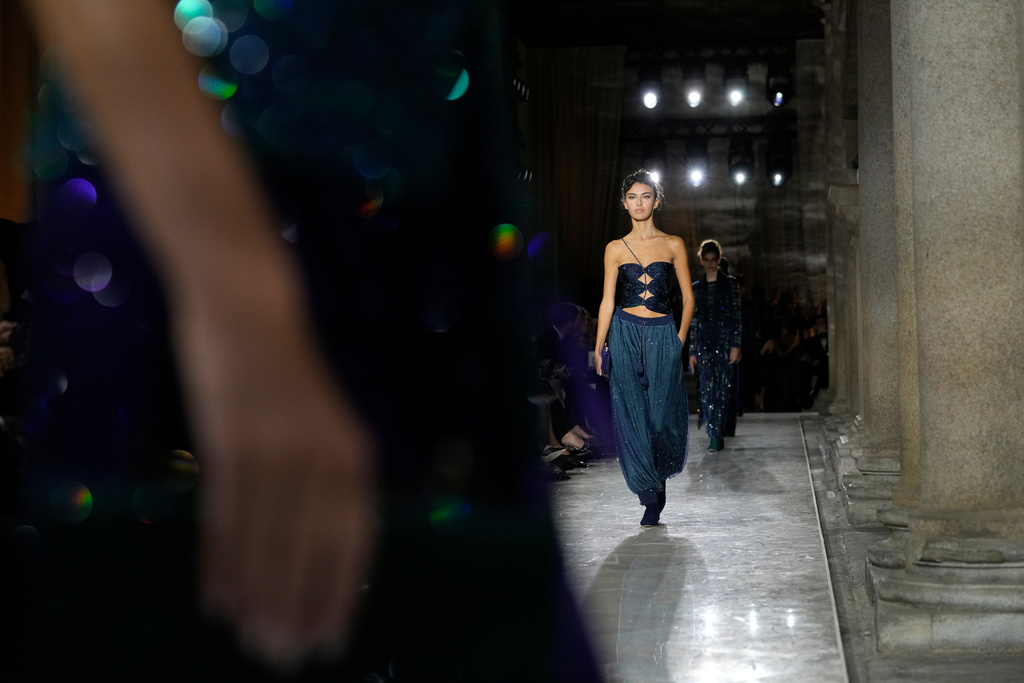 Models wear creations as part of the Giorgio Armani SpringSummer 2026 collection show in Milan, Italy, Sunday, Sept. 28, 2025. (AP)